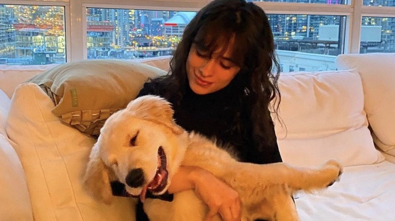 Camila Cabello holding puppy Tarzan