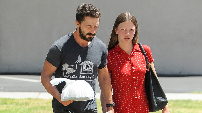 Mia Goth and Shia LaBeouf walking