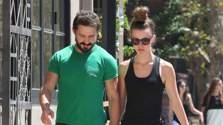 Mia Goth and Shia LaBeouf walking