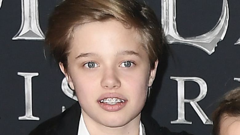 Shiloh Jolie-Pitt staring at camera