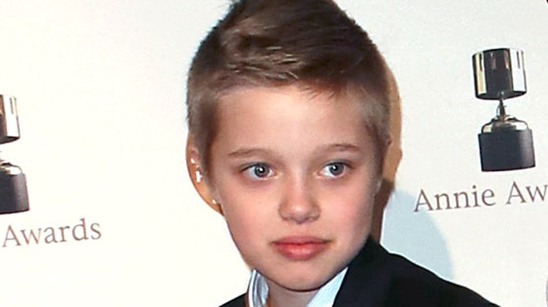 Shiloh Jolie-Pitt staring at cameras