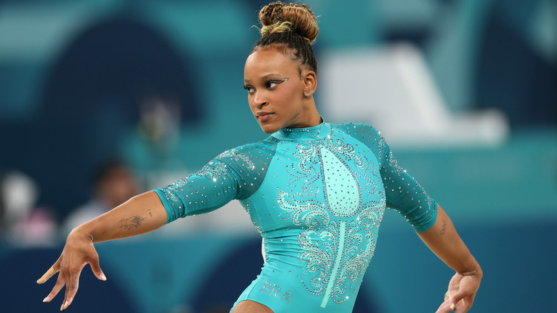 Rebeca Andrade in teal costume during competition