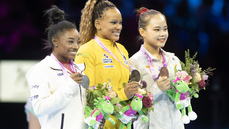 Rebeca Andrade & Simone Biles smiling on podium