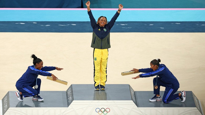 Simone Biles and Jordan Chiles bow to Rebeca Andrade