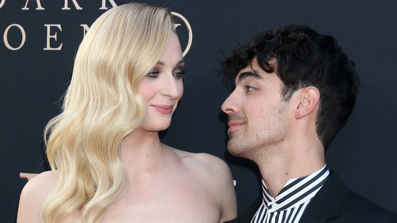 Sophie Turner looking at Joe Jonas