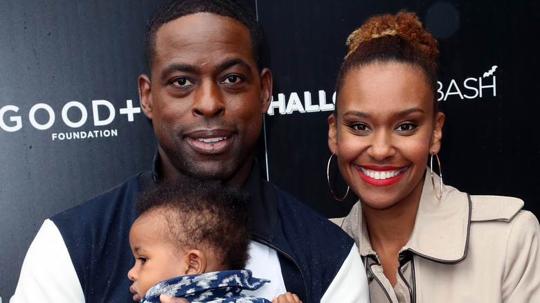 Ryan Michelle Bathe and Sterling K. Brown with their son