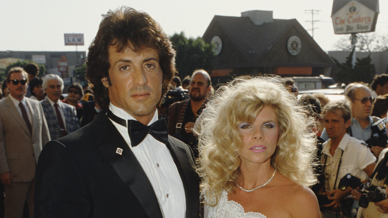 Sylvester Stallone and Sasha Czack posing for photos on the red carpet