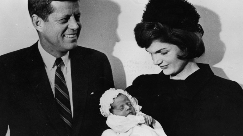 JFK and Jackie Kennedy pose with baby JFK Jr.