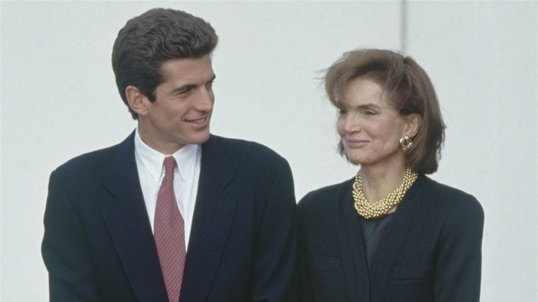 JFK Jr smiling at Jackie Kennedy Onassis