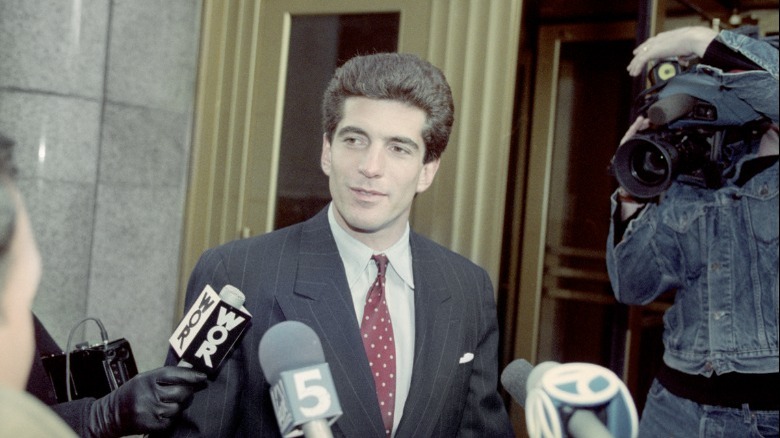 JFK Jr press conference, speaking into microphones