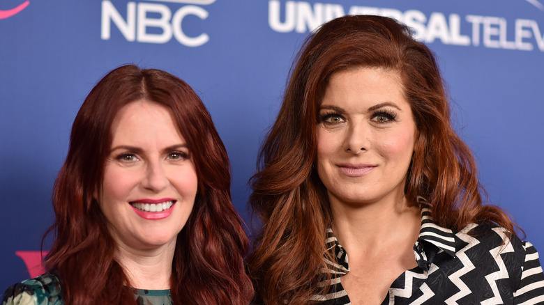 Megan Mullally and Debra Messing smiling