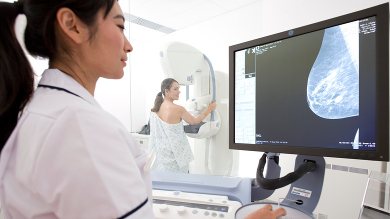 Doctor performing a mammogram 