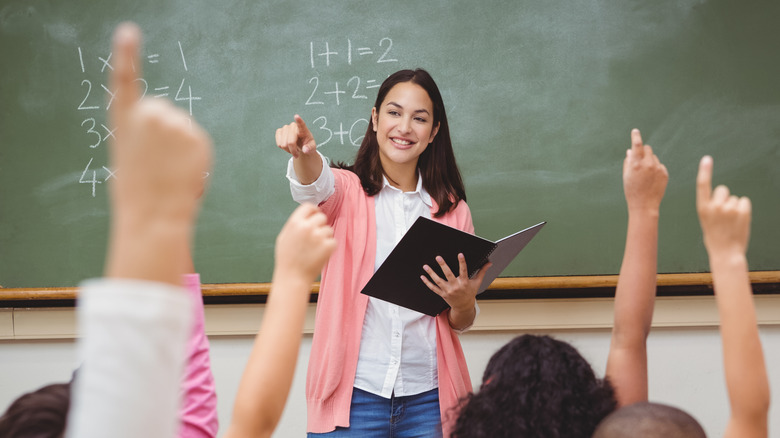 Smiling female teacher in classroom