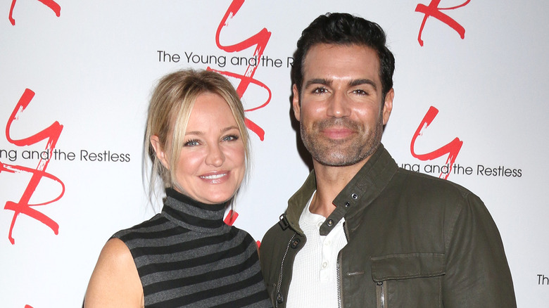 Sharon Case posing with Jordi Vilasuso