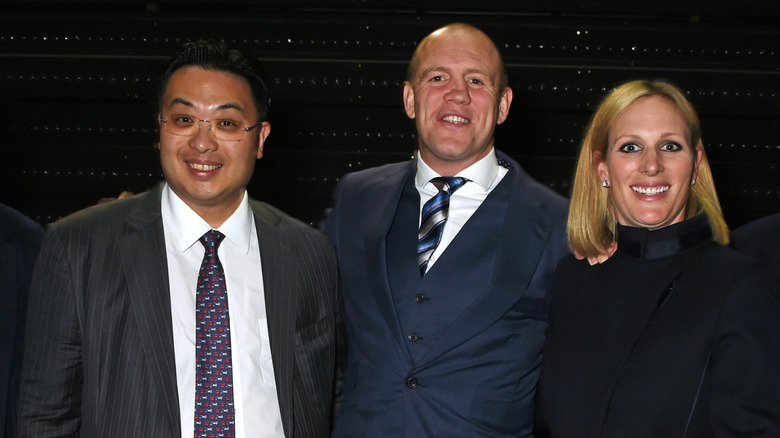 Zara and Mike Tindall posing with Johnny Hon