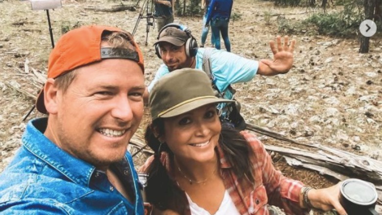 Ben and Christi Dozier posing with a team member