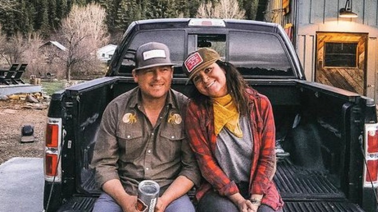 Ben and Christi Dozier cozying up on the back of a truck