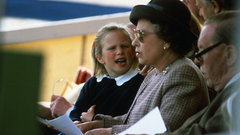 Young Zara Tindall talking to Queen Elizabeth