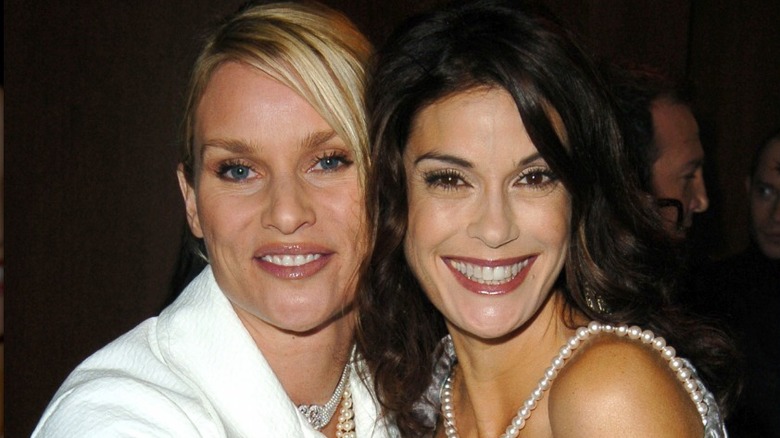 Nicolette Sheridan and Teri Hatcher side hugging for a photo