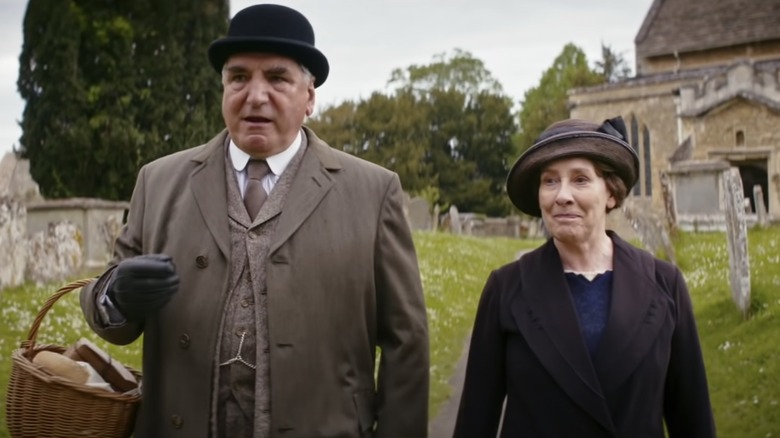 Jim Carter as Mr. Carson and Phyllis Logan as Mrs. Hughes filming Downton Abbey in Bampton