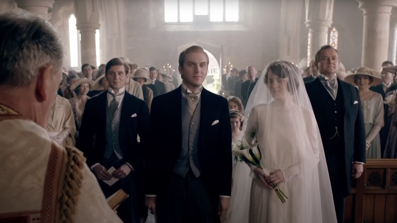 Dan Stevens as Matthew Crawley and Michelle Dockery as Mary Crawley filming their wedding in Downton Abbey