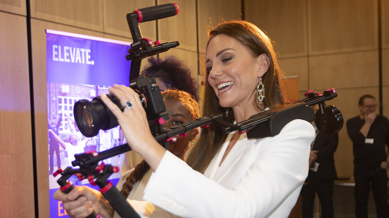 Kate Middleton holding camera equipment