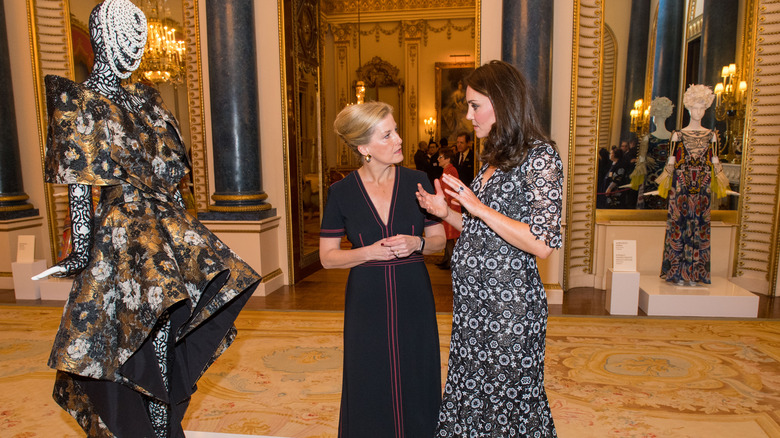 Kate Middleton & Sophie Wessex admiring dress