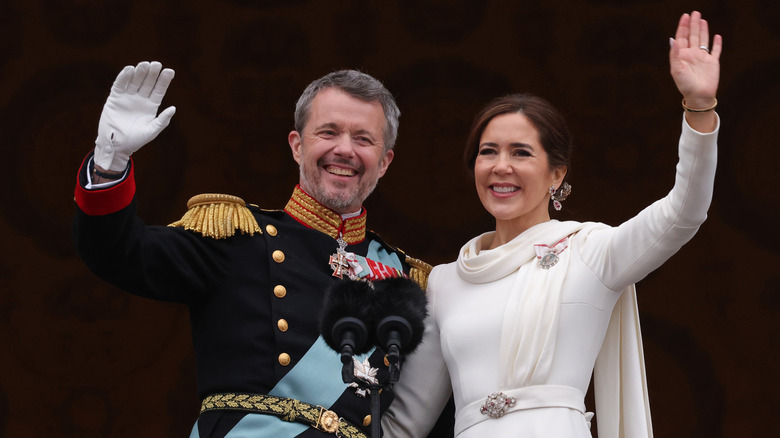 King Frederik X and Queen Mary wave from the balcony of Christiansborg Palace following his coronaiton.