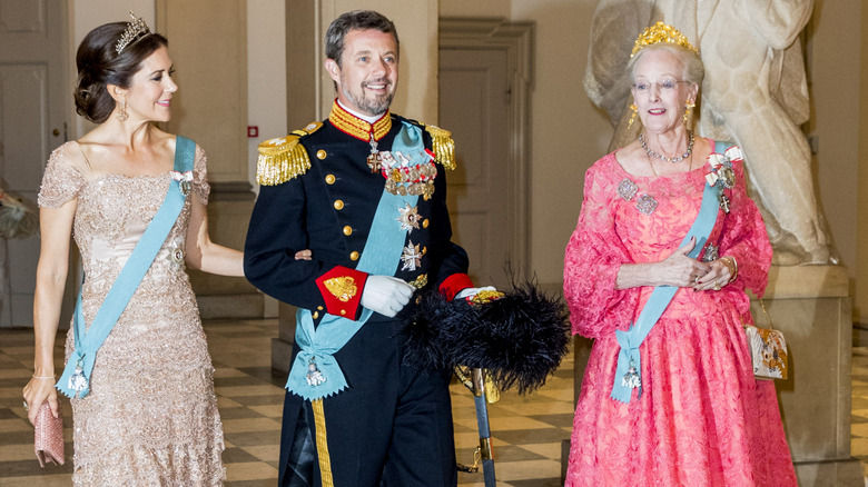 Queen Mary, Frederik, and Margrethe arrive at the prince's 50th birthday