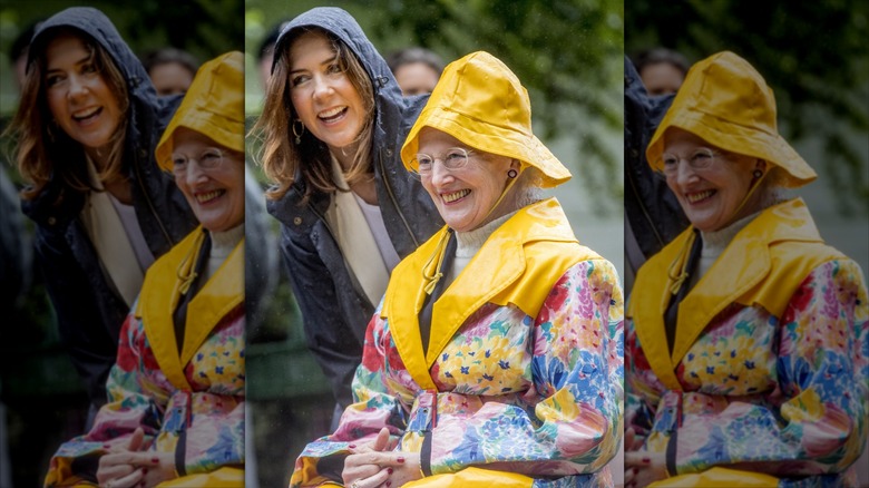 Queen Margrethe and Mary share a laugh on a rainy day