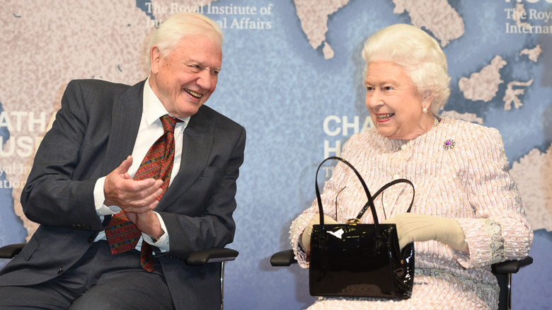 David Attenborough and Queen Elizabeth smiling 