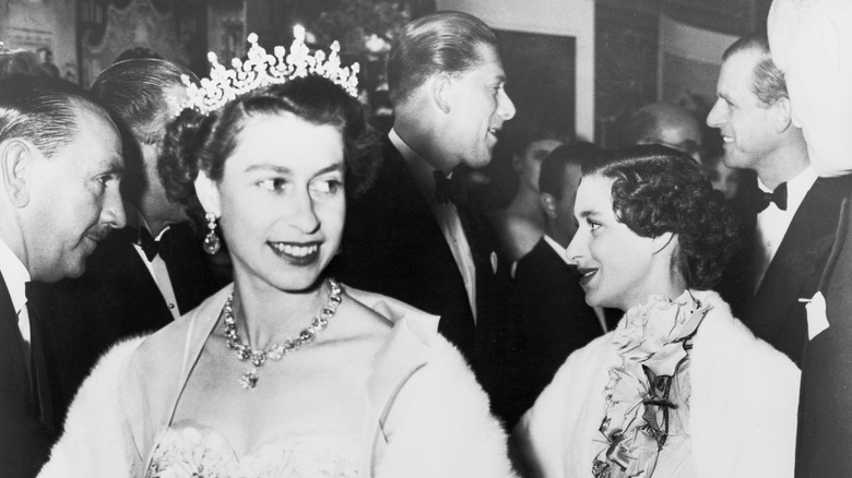 Young Queen Elizabeth smiling and walking