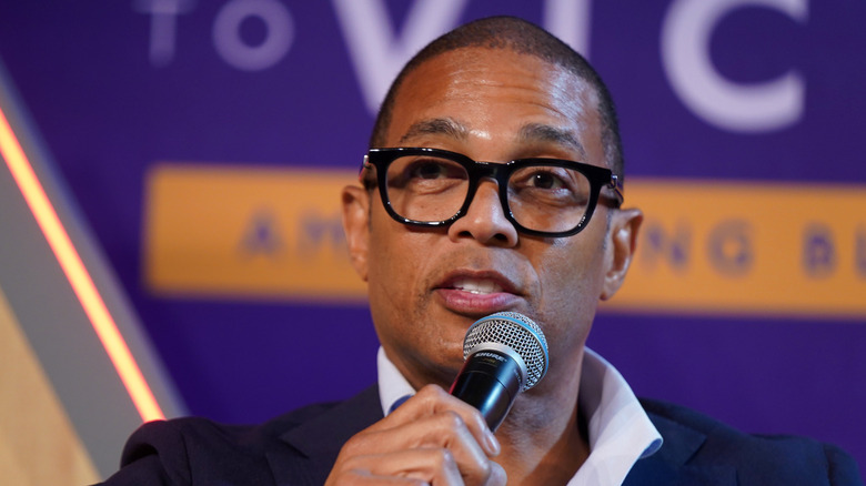 Don Lemon speaking into a microphone