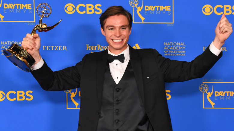 Nicholas Chavez holding a Daytime Emmy