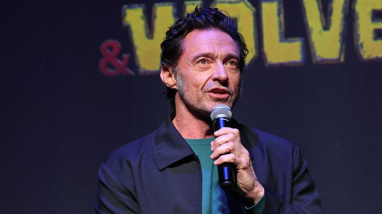 Hugh Jackman speaking into a microphone