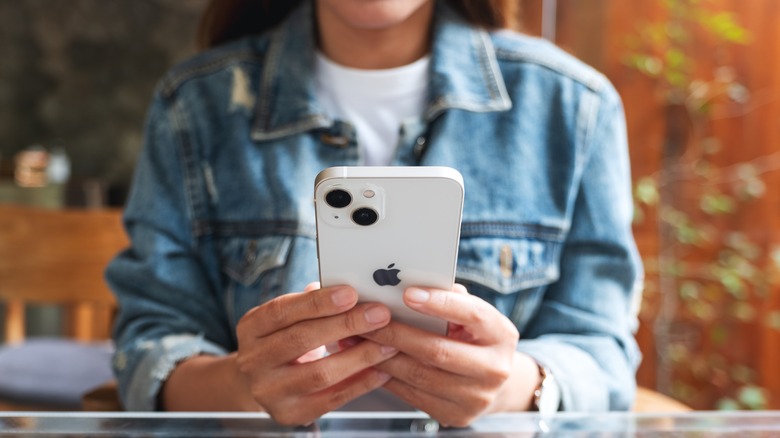 Woman holding an iPhone