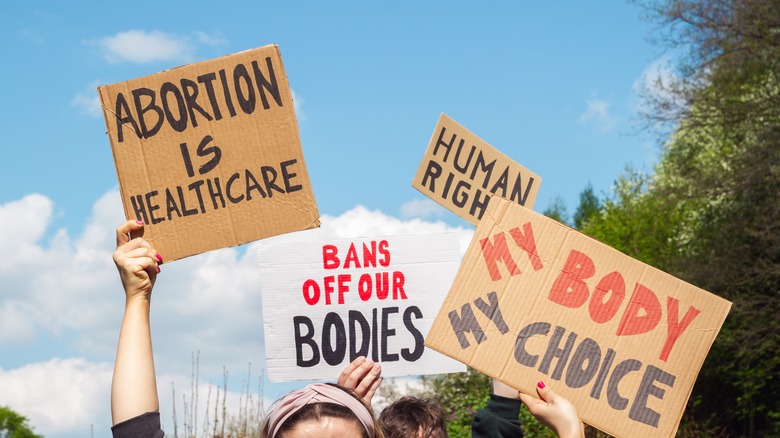 Pro-abortion protestors holding signs