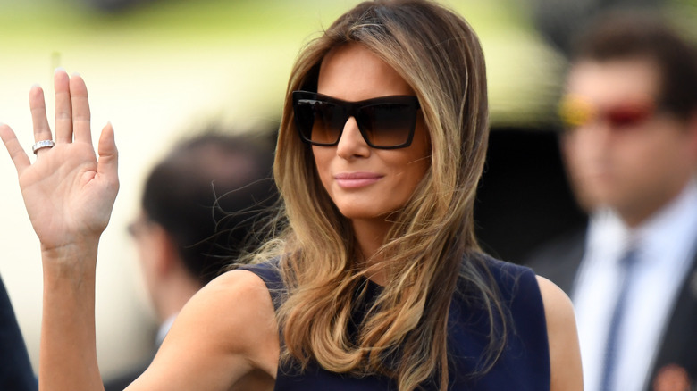 Melania Trump waving in sunglasses