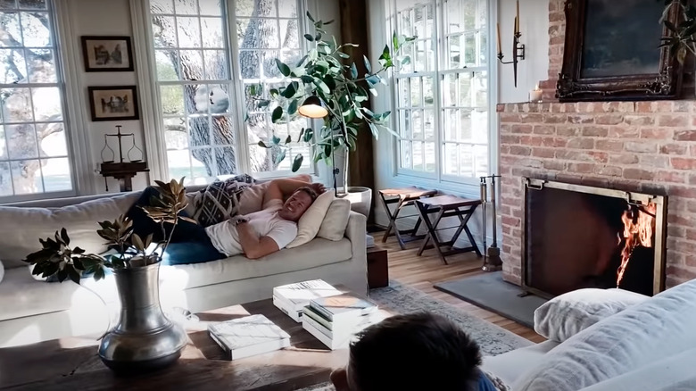 Chip Gaines lounging in living room