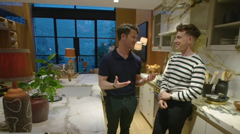 Nate Berkus, Jeremiah Brent smiling in kitchen