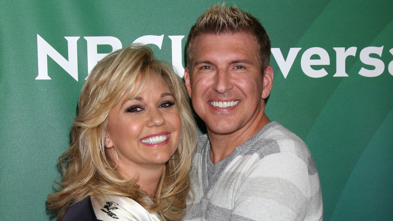 Julie and Todd Chrisley cuddling up on the red carpet