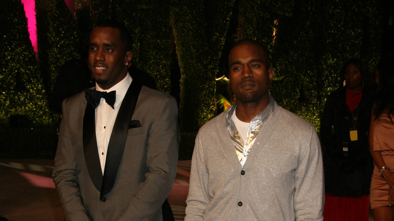 P Diddy and Kanye West stand side by side.