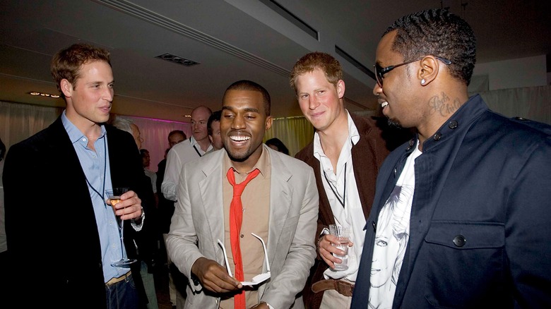 Kanye West, P Diddy, and Princes William & Harry talking at a party.