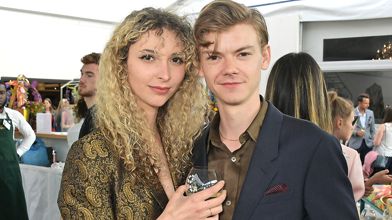 Thomas Brodie-Sangster and Gzi Wisdom posing