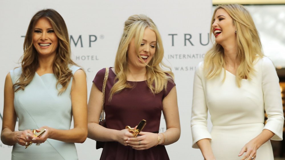 Melania, Tiffany, and Ivanka Trump grinning