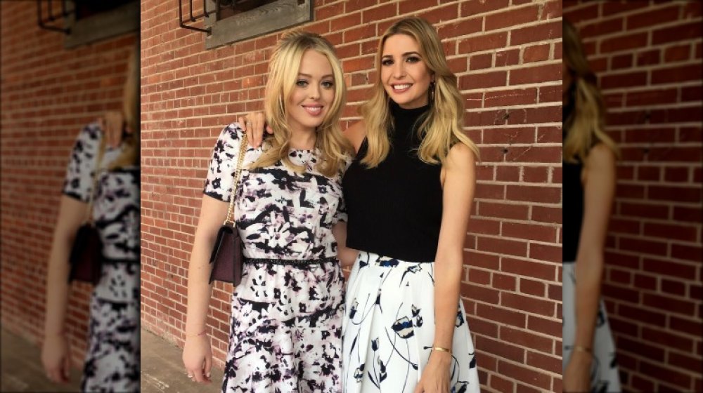 Ivanka Trump and Tiffany Trump in front of a brick wall