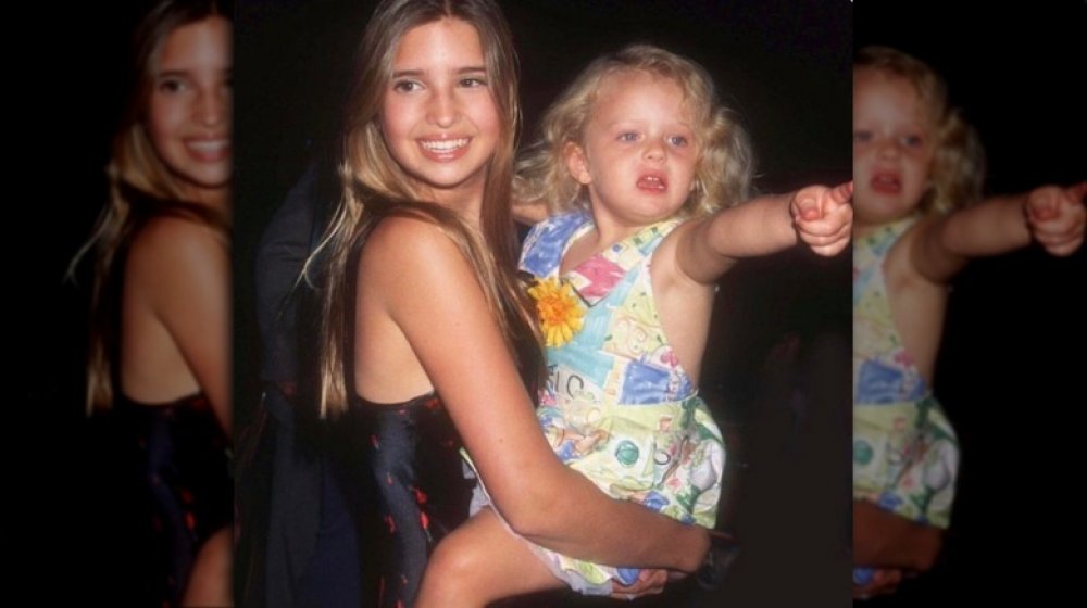 Ivanka Trump holding Tiffany Trump as a baby