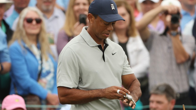 Tiger Woods adjusting his watch