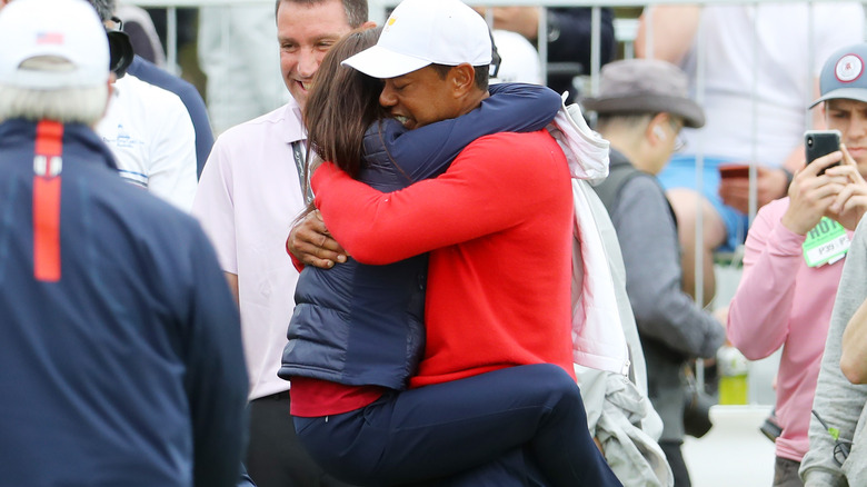 Tiger Woods hugging girlfriend Erica Herman