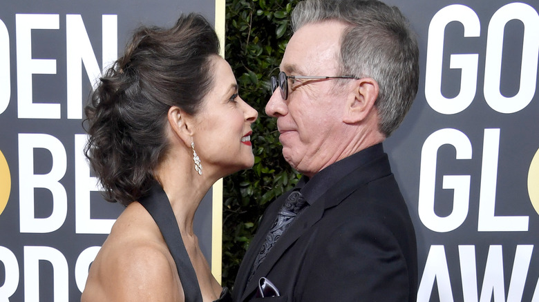 Tim Allen and Jane Hajduk facing each other on red carpet